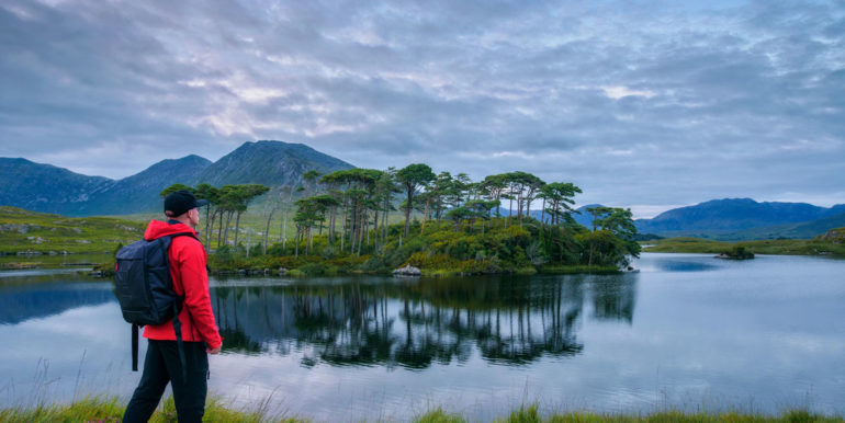 Young hiker at the Pine Island in Derryclare Lough