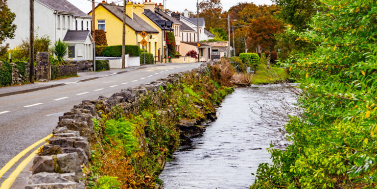 Houses and road  and Owenriff river in Oughterard