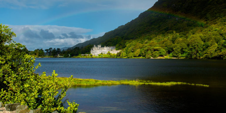 Kylemore Abbey in Ireland under a Rainbow